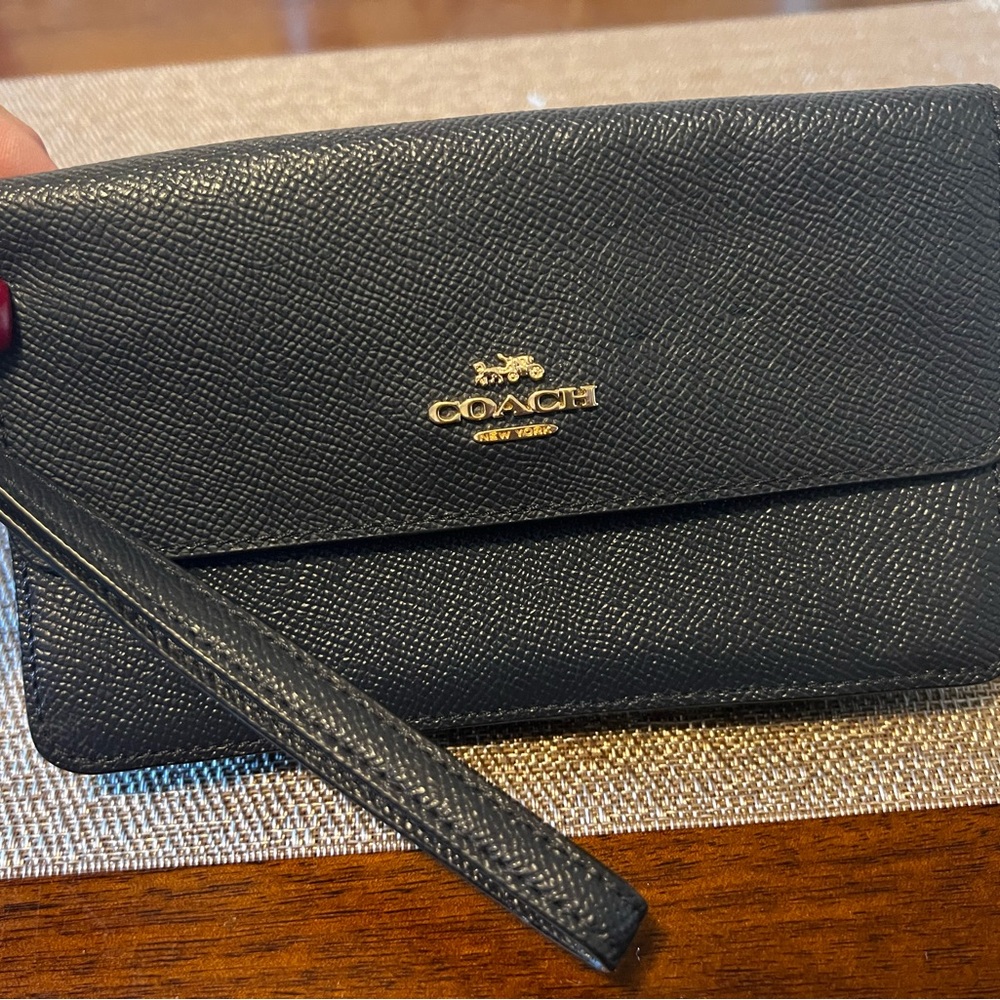 Coach gently used wristlet wallet.  Navy blue.